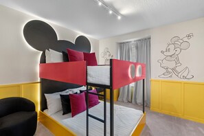 Bedroom decorated with Mickey Mouse theme, a journey into the world of Disney.
