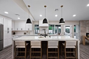 Our cooking space has an expansive kitchen and a stylish center island! Whether you're a gourmet chef or just love to dine in style, this kitchen has it all.