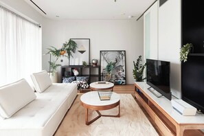 Relax in the design-driven living area while enjoying a spot of TV or a good book.
