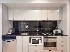 The sleek kitchen comes well-equipped for your holiday catering and includes a dishwasher for easy clean-up.
