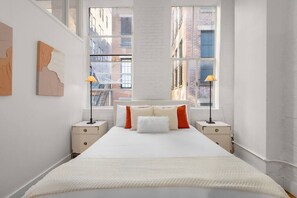 A dreamy bedroom oasis with stunning NYC views.