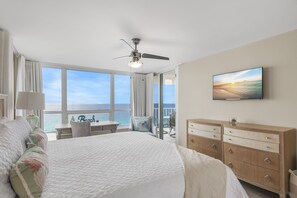 Spacious Master Bedroom with King Bed, Smart TV, Gulf Views, Chair and Desk Workspace, Balcony Access, Remodeled bathroom with soaker tub & walk-in shower