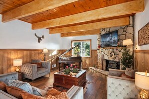 Living area to cozy up by the fire