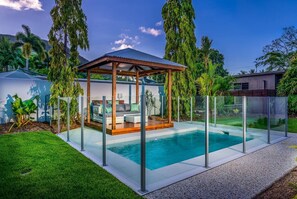 This expansive property features a second pool with a shaded to cabana to lounge around while the kids swim.