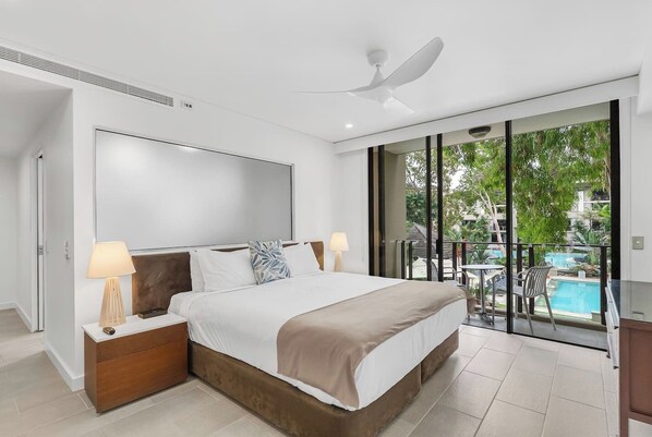 The studio suite is set with a comfortable king bed with a cooling breeze from the ceiling fan and central air-conditioning.