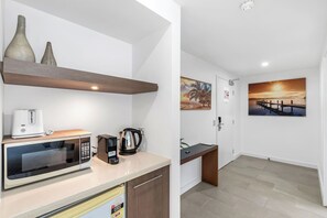 The studio’s compact kitchenette offers added convenience—ideal for quick breakfasts, late-night snacks, or enjoying your morning coffee in peace.