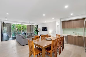 The dining area seats all guests, inviting you to enjoy home-cooked meals together as a group.