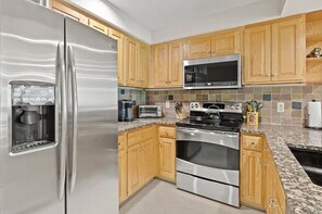 Kitchen woith dishwasher, stove, oven, microwave, keurig, and all necessities.