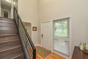 Just inside you'll be greeted by a high ceiling entry, head right to enter downstairs living quarters or upstairs for all sleeping quarters. All bedrooms are upstairs!