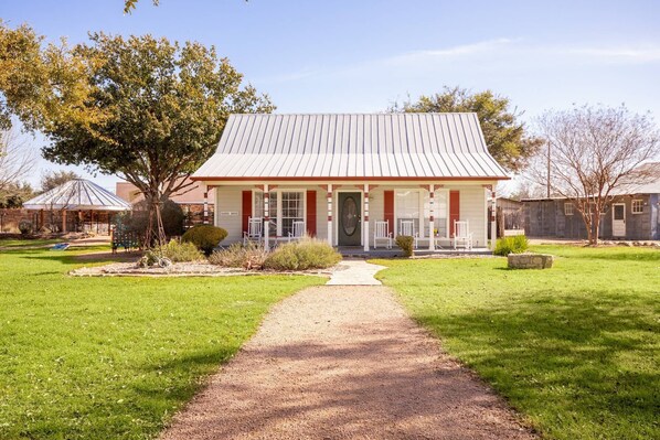 Step into The Ranch House, where history seamlessly meets comfort and country charm. It is the closest to The Oasis Pool.