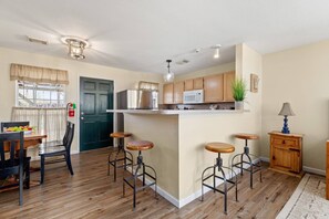 Whether you're enjoying a casual meal or sipping drinks at the counter, this dining space adds a touch hominess.