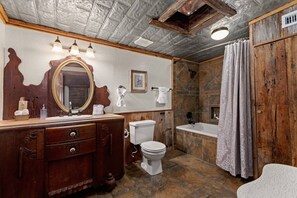 Picture yourself in this opulent space, surrounded by the unique craftsmanship of the antique vanity and the soothing ambiance of the jacuzzi tub.