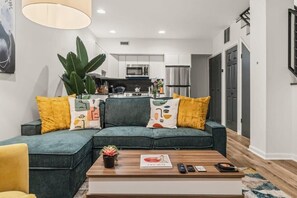 You'll love the vibrant living area with its modern design and comfortable seating. Perfect for entertaining or relaxing, this space is designed to make you feel at home.