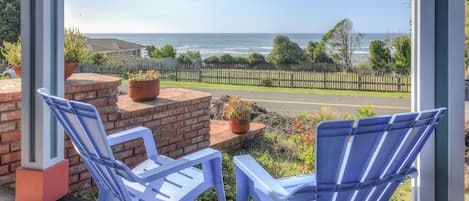 Breath in the ocean air on the porch with outdoor seating