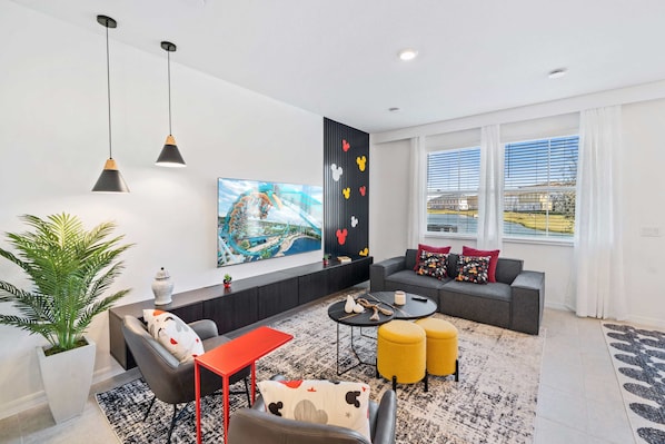 Enchanting Living Area of the Townhouse in Davenport Florida - Smart TV and Netflix - Elegant Micky Themed decor - Stylish furniture arrangement providing comfort and a cohesive look