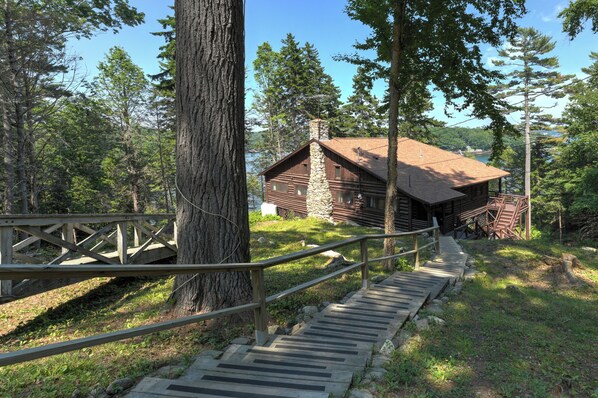 Stairs leading to entrance door of Cabin.