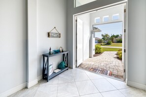 Inviting entryway - - Step into this bright, open entryway that warmly invites you to explore
- Thoughtful coastal decor and plenty of natural light create an uplifting first impression
- Enjoy a seamless blend of indoor comfort and outdoor charm as you arrive