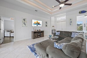 Spacious living - - Sink into the plush sectional and enjoy the spacious, light-filled living area
- Elegant high ceilings and coastal touches create a relaxing yet vibrant vibe
- Perfect for beautiful evenings, lively gatherings, or quiet moments to unwind