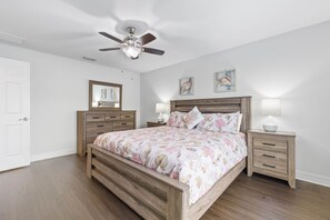 Tranquil Haven - - Beautifully crafted bed frame with soft, floral linens creates an inviting and restful feel
- Matching dresser and nightstands add cohesive style and practical storage
- Ceiling fan, warm lighting, and natural design enhance the serene ambiance