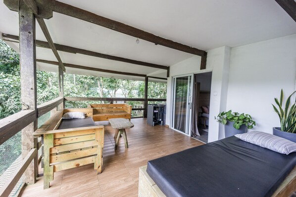 A generous wraparound balcony to fully enjoy the natural surroundings.