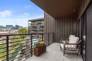 Balcony with gorgeous pool view and seating