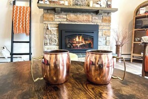 Enjoy a sip of your favorite beverage by a cozy fire