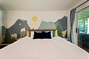 The first floor Mountain Room boasts a hand painted mural by a local painter, a plush king-sized bed, and a desk with a view for when you need to sneak away to do a little work.
