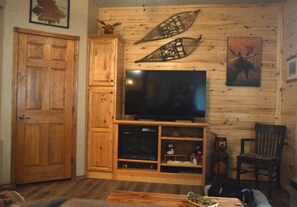 living room. nice knotty pine around living room and dining room