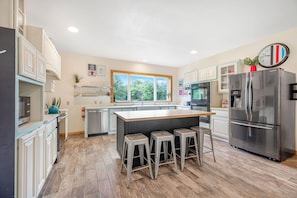 Gather around the large kitchen island to enjoy breakfast and plan the day