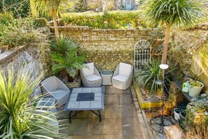 The home has a private walled courtyard, and catches the morning sun.