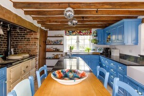 The beautiful, farmhouse-style kitchen is the heart of the home.