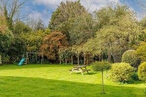 The home has a large garden with children's play equipment.