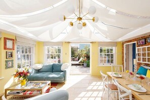 The bright and airy orangery is the perfect space for dining and socialising.