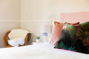 Camber has peach and pink furnishing and hints of green to create a calm and stylish space.