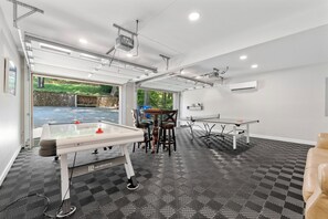 Converted garage to game room with ping pong &  air hockey. 