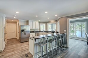 Kitchen with bar seating for 4. 
