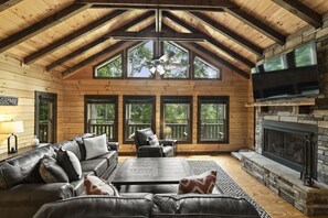 Get cozy by the fire in this spacious living room.
