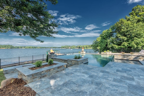 Luxurious pool overlooking the lake.