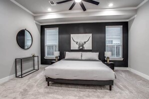 With a beautiful accent wall, Texan-style artwork, and matching nightstands, this bedroom is sure to bring you nothing but sweet dreams!