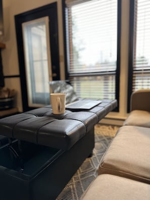 Ottoman doubles as desk
