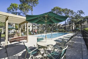 Relax by the pool with plenty of lounge chairs, shaded seating, and even a cozy porch swing. Whether you're soaking up the sun, enjoying a refreshing swim, or unwinding in the shade, this is the perfect spot to recharge after a day at the beach!