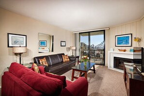 living room with queen and single sleeper sofa, balcony ocean views