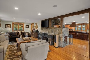 Living room w/ fireplace.