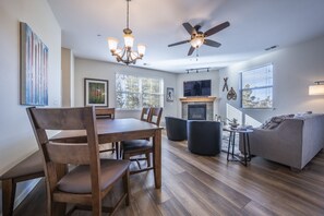 Living- and dining area - Living room with sleeper sofa, fireplace and large LED smart TV