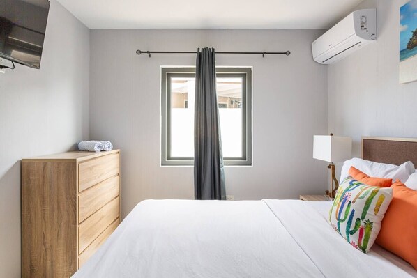 The bedroom has a king-sized bed that can comfortably accommodate two guests.