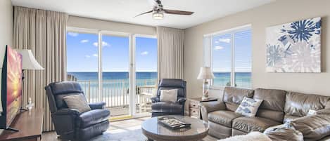 This 3BR/3 BA updated condo features a bright and open living and dining space with tall ceiling, Gulf views, and plenty of seating around a large Smart TV for all your streaming needs.