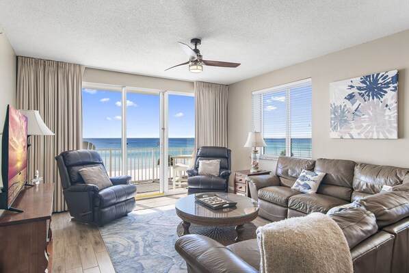 This 3BR/3 BA updated condo features a bright and open living and dining space with tall ceiling, Gulf views, and plenty of seating around a large Smart TV for all your streaming needs.