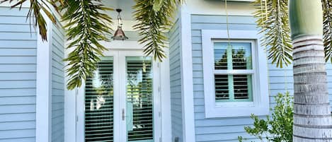 Caribbean style home with authentic ship light entrance.