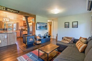 Cozy couch with TV and wood fire stove 