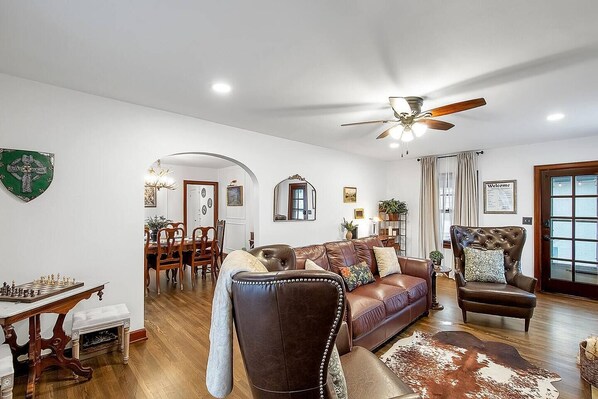 Gorgeously decorated living room with renaissance decor and cozy seating